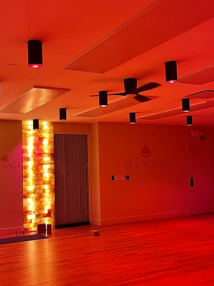 A studio glowing orange from its Himalayan salt wall